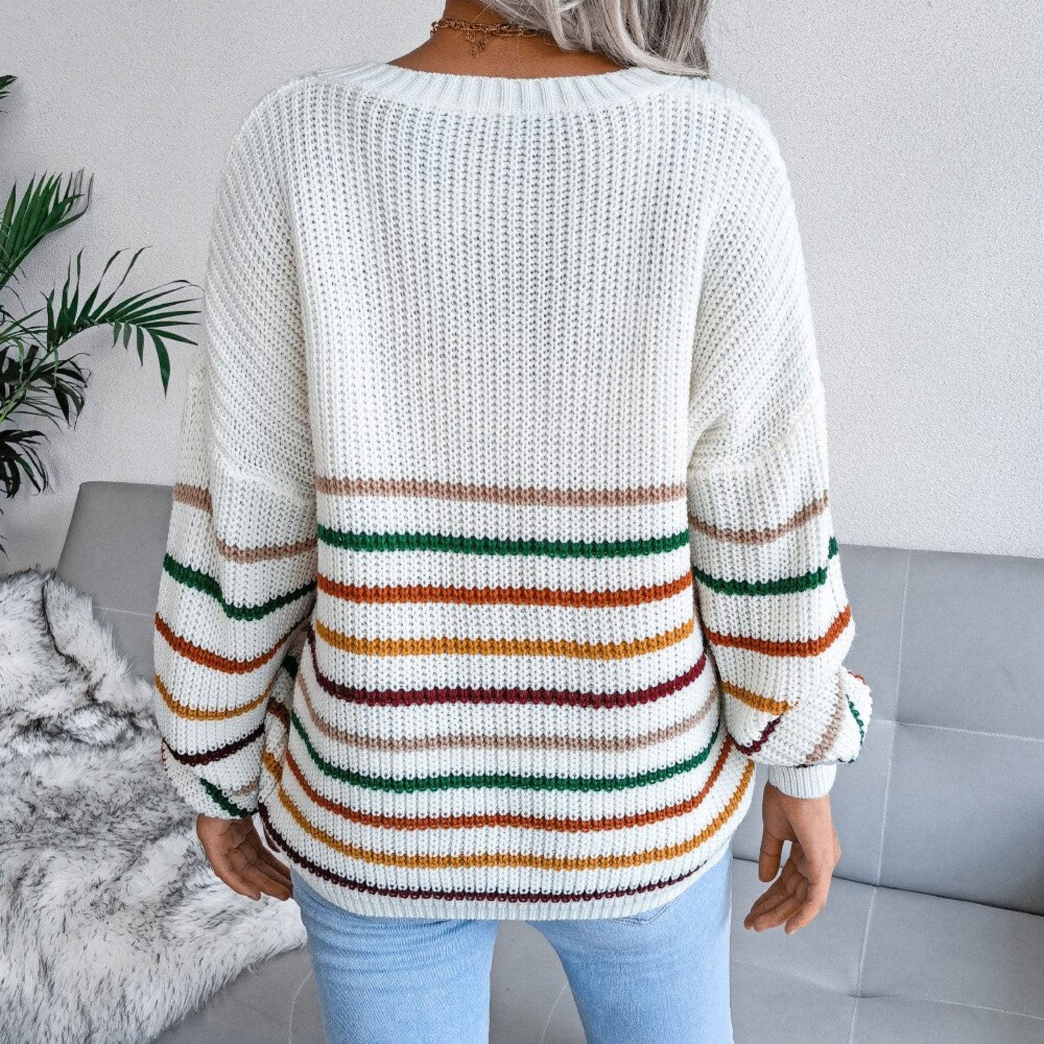 Girl weaing white striped v neck top sweater